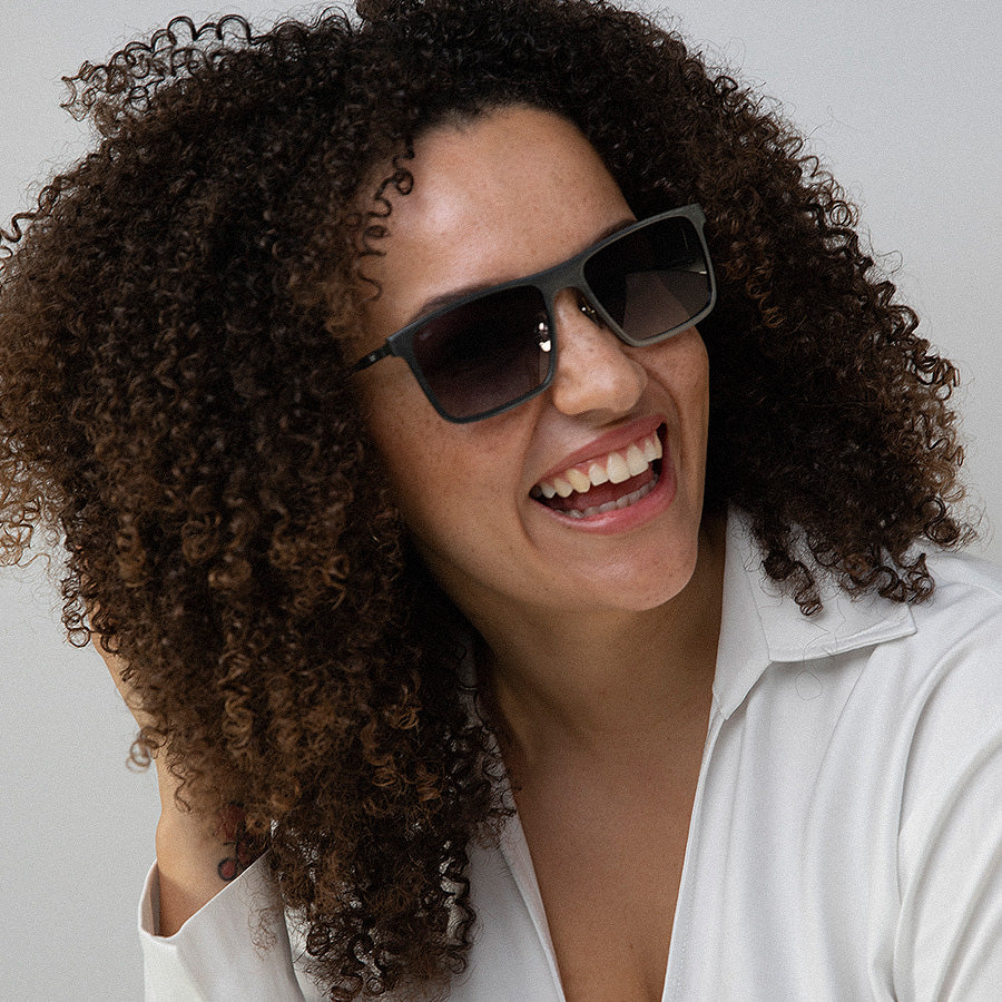 Black woman wearing metal rectangle sunglasses