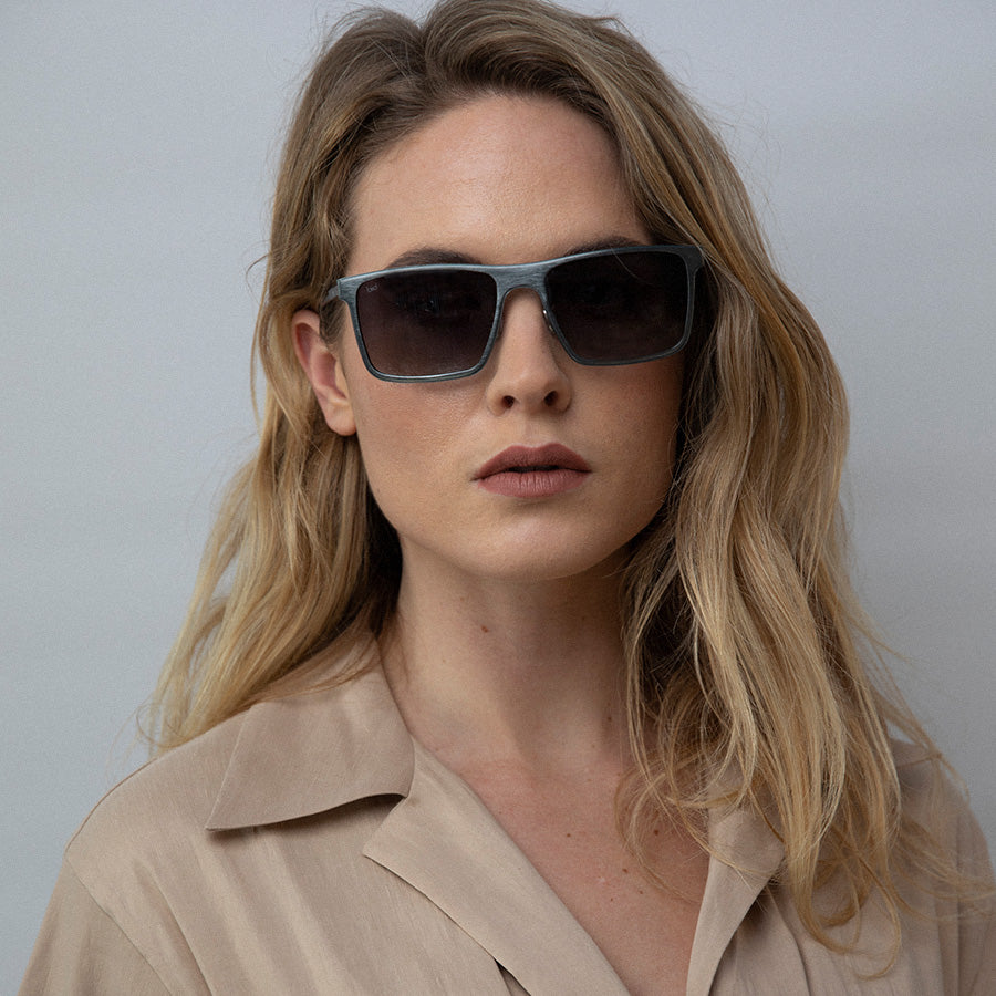 Woman wearing metal rectangle sunglasses