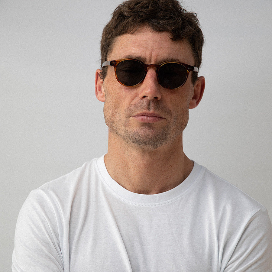 Man wearing Caramel bio acetate round sunglasses front view