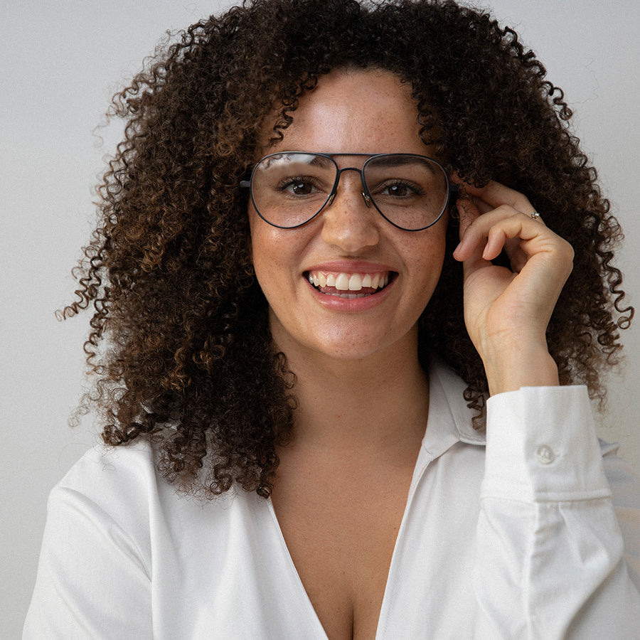 Black woman wearing Aviator glasses with silver frame