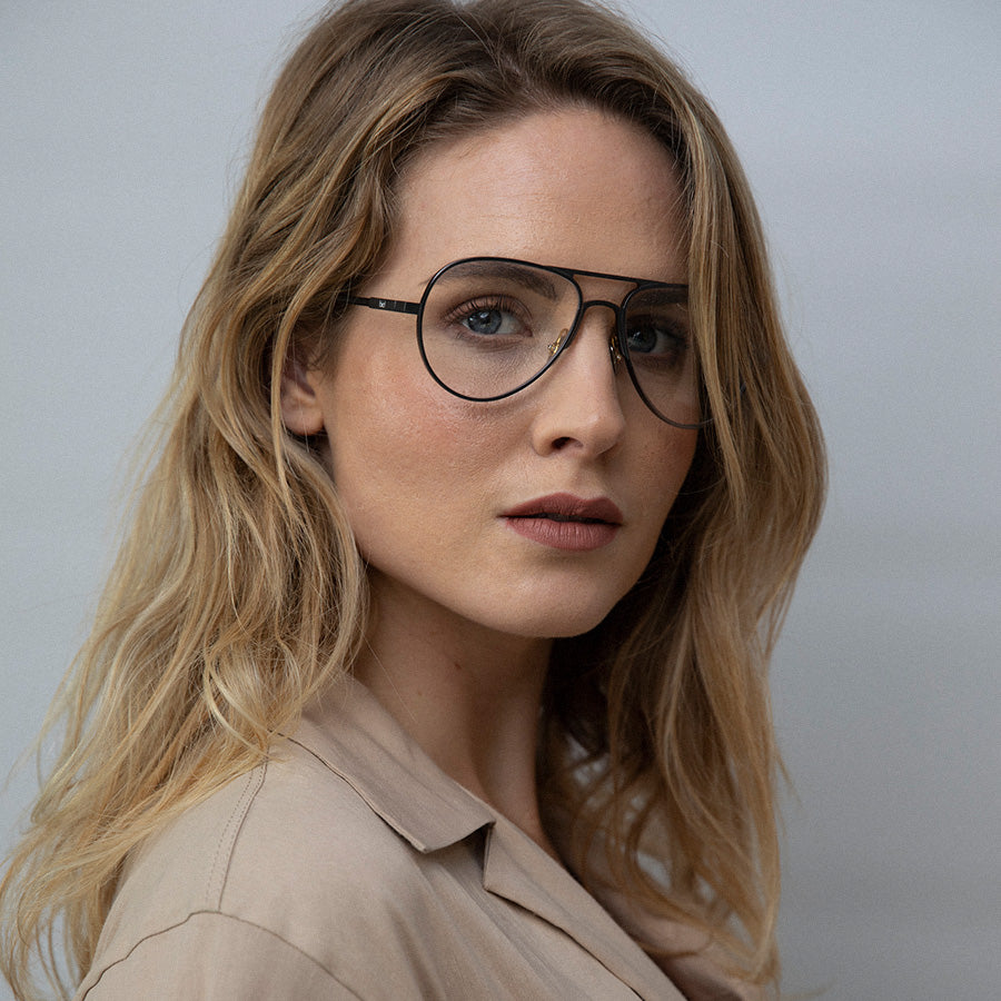 Woman wearing Aviator glasses with silver frame