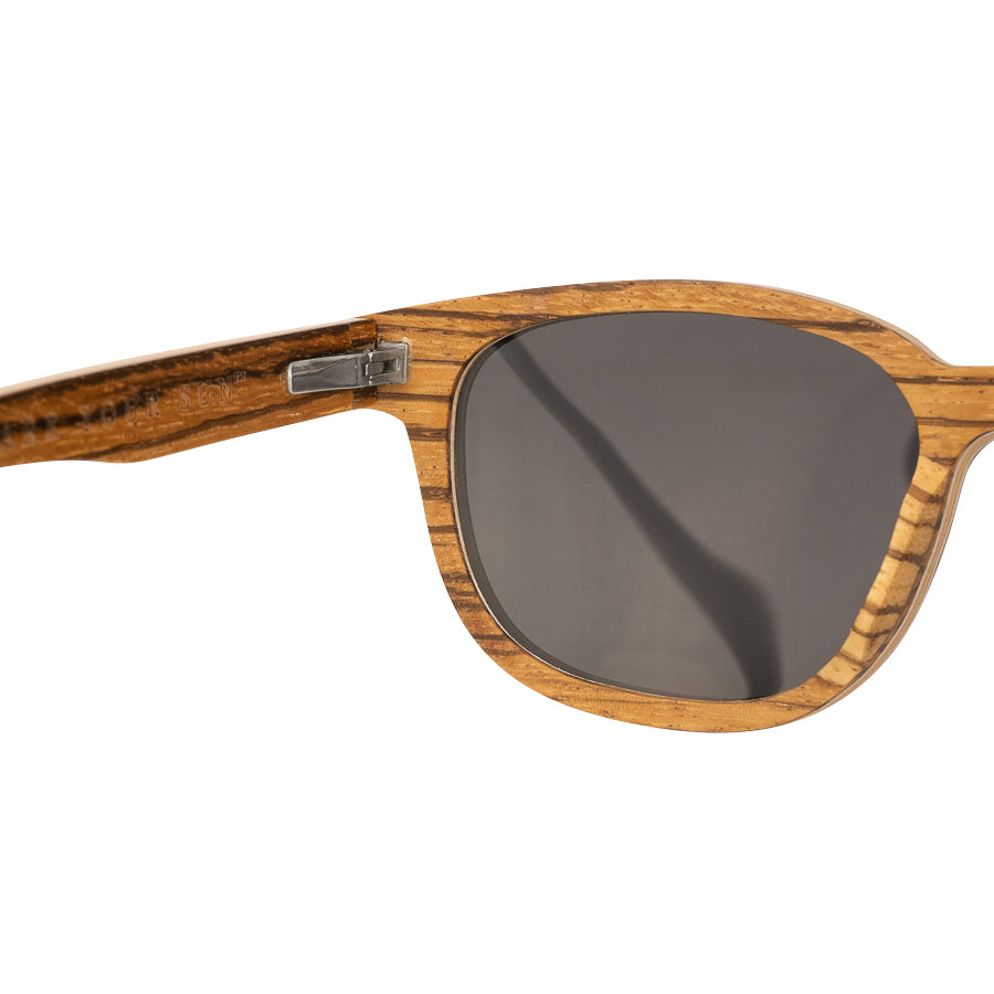 Close up lens detail of Eco conscious wooden sunglasses with light coloured wood