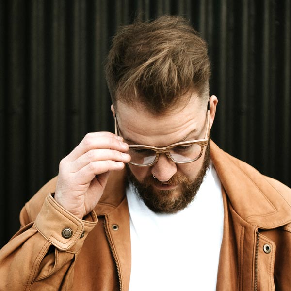 Richard James wearing eco friendly glasses made with light wood 