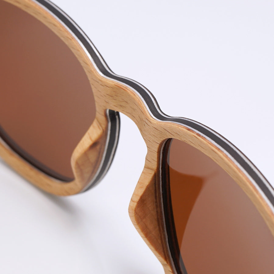 Detailed view of black and red wooden sunglasses 